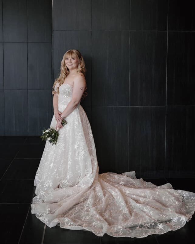 Alexa wearing wedding dress with perfect length alterations by Anna bridal dress alterations expert Pittsburgh